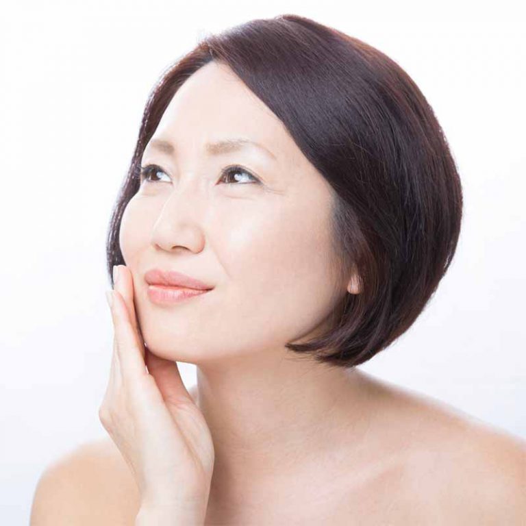 Asian Woman with Hand on Face
