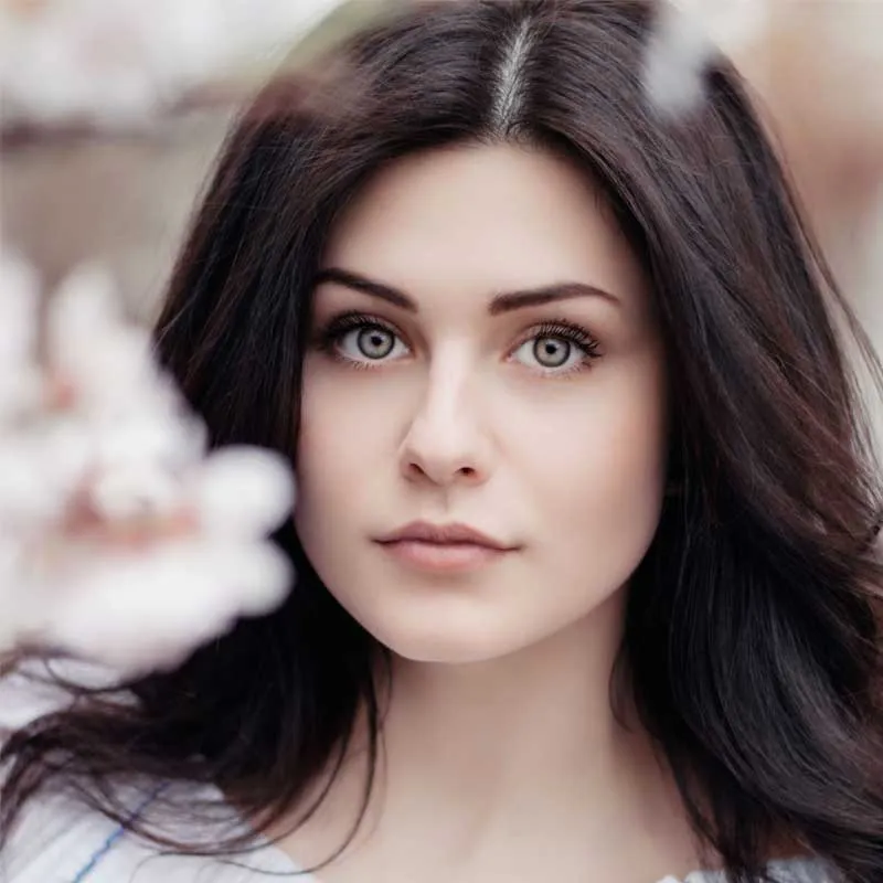 woman who just received microneedling treatment from Elume Med Spa