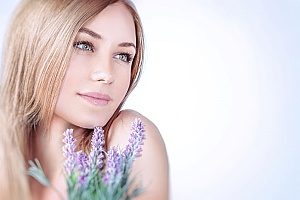 a woman enjoying the results of her recent filler treatments at a medical spa