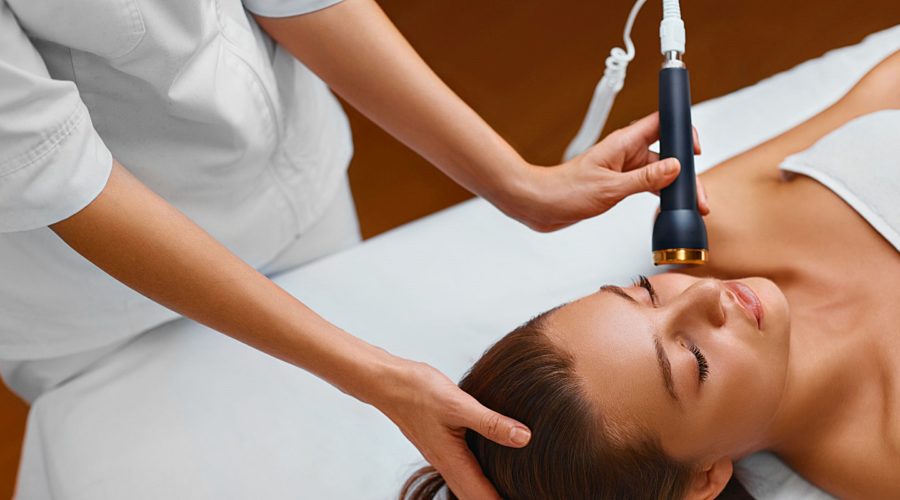 a woman receiving a massage as well as microdermabrasion treatment at a medical spa in order to feel refreshed and have hydrated, radiant and facial line-free skin