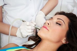 realxed women receiving microdermabrasion treatment