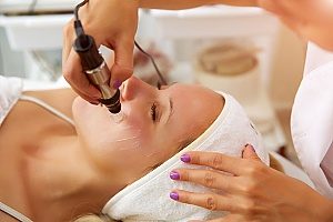 blood being drawn from a woman receiving microneedling with PRP from a Fairfax, VA medical spa