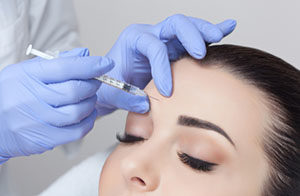 woman receiving botox injections
