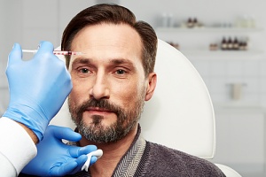a man receiving botox treatments for his migraines