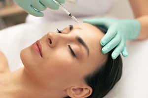 a woman getting some botox injections for her migraines