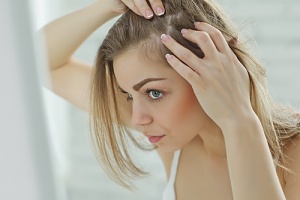 woman considering microneedling for her hair loss