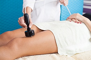 a woman receiving Venus Legacy treatment in her legs