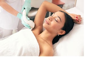 Woman receiving laser hair removal treatment