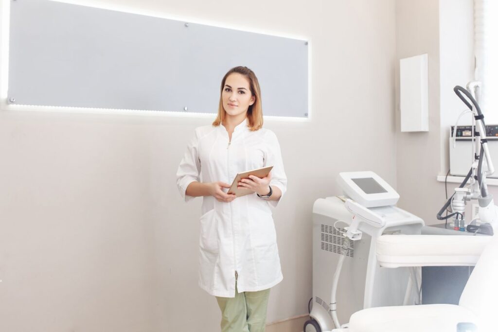 Nurse practitioner standing after performing a Morpheus8 treatment